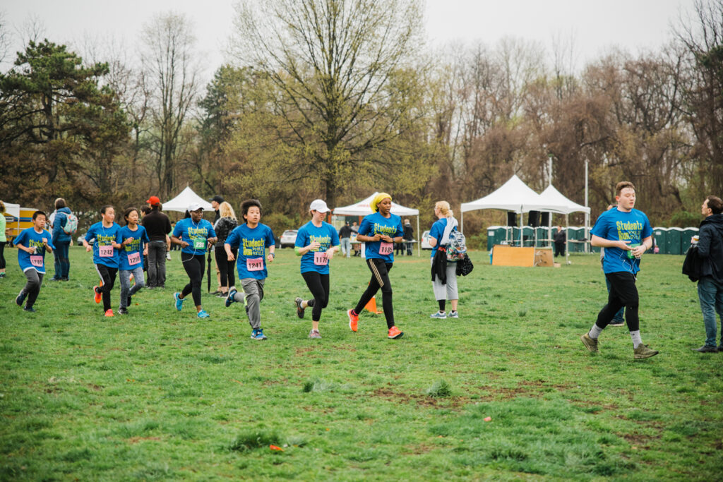 Students race towards the finish line. Photo by Heather McBride.